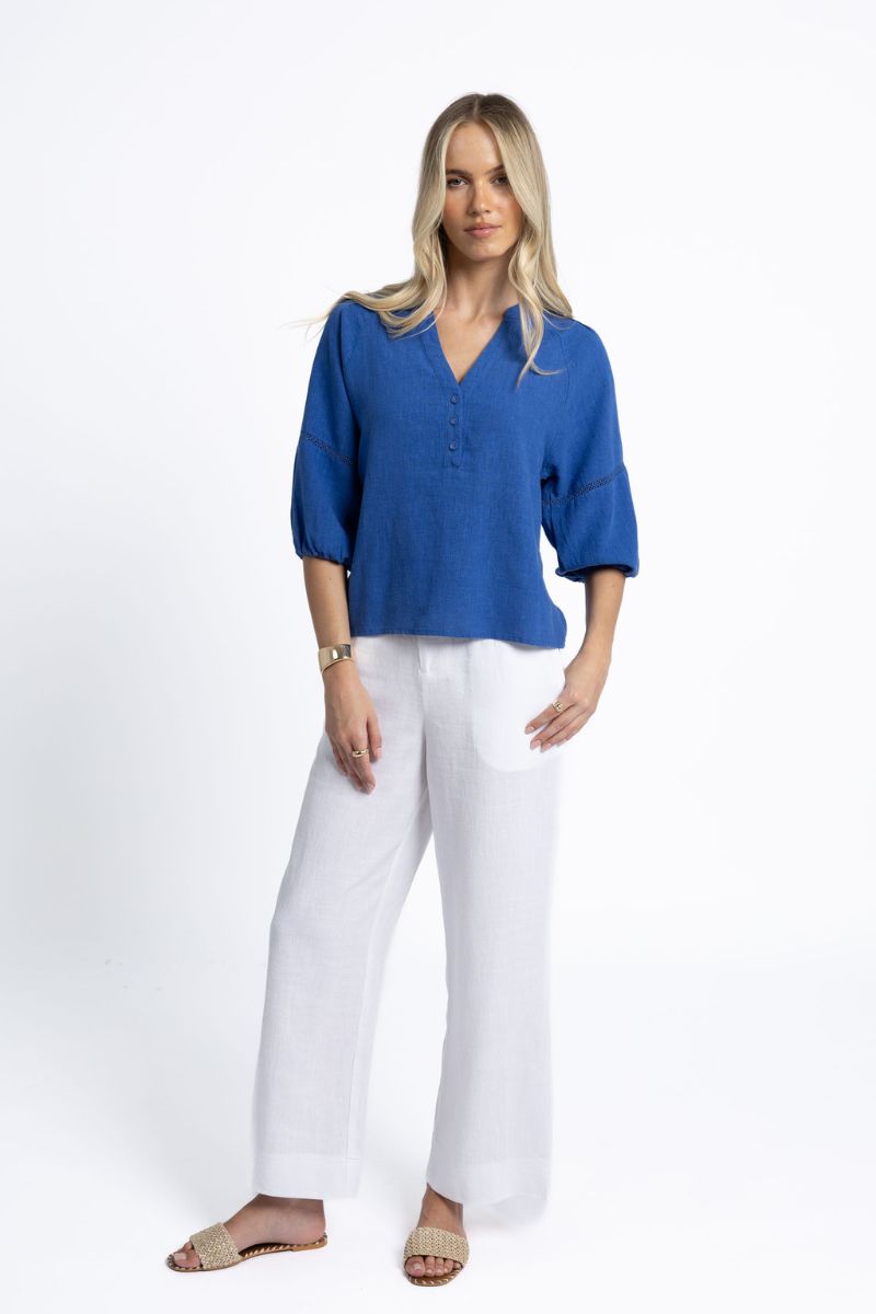 Woman wearing Humidity Lifestyle HS25200 Nixie Blouse Royal Blue full outfit view