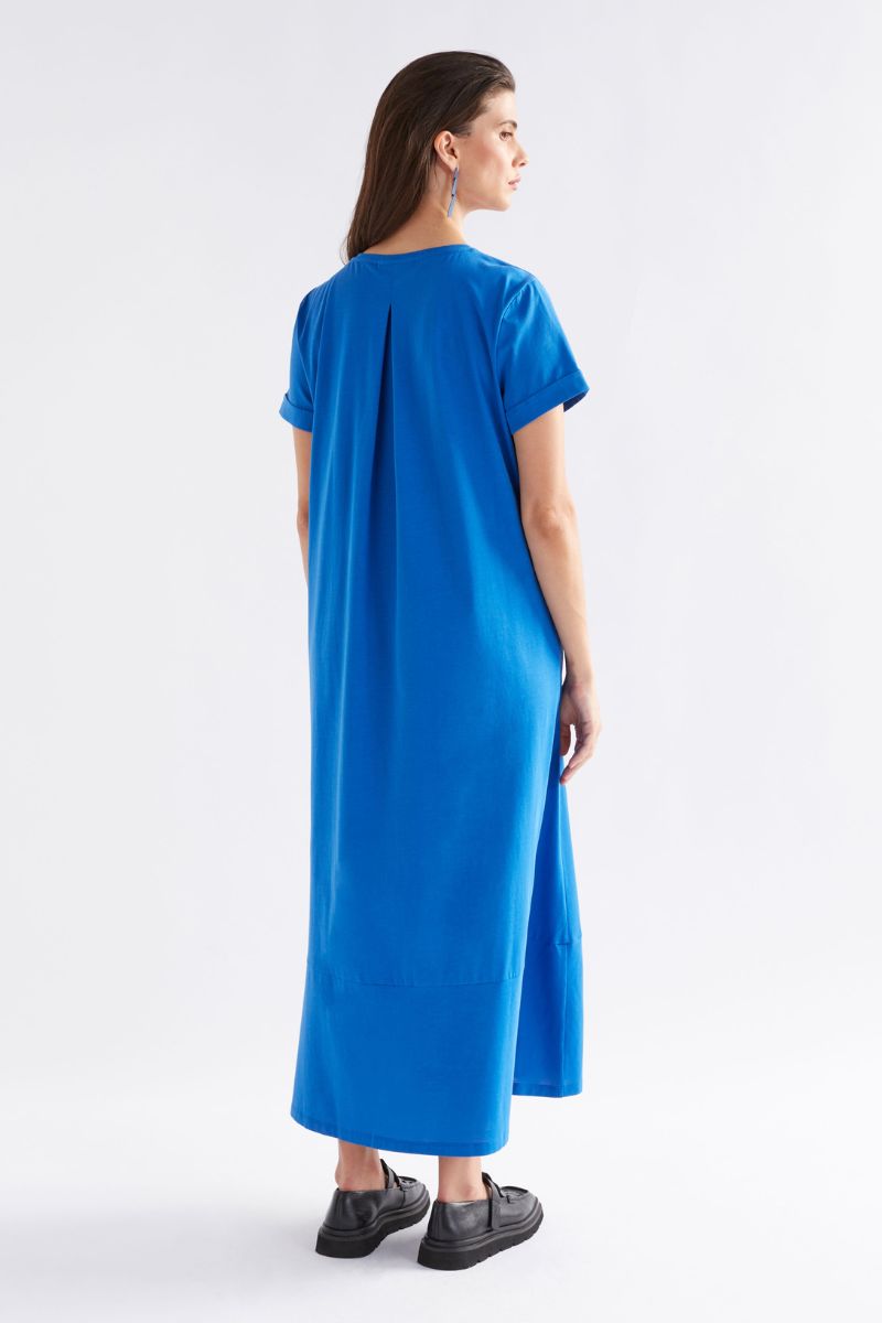 Woman wearing a blue dress on a white background