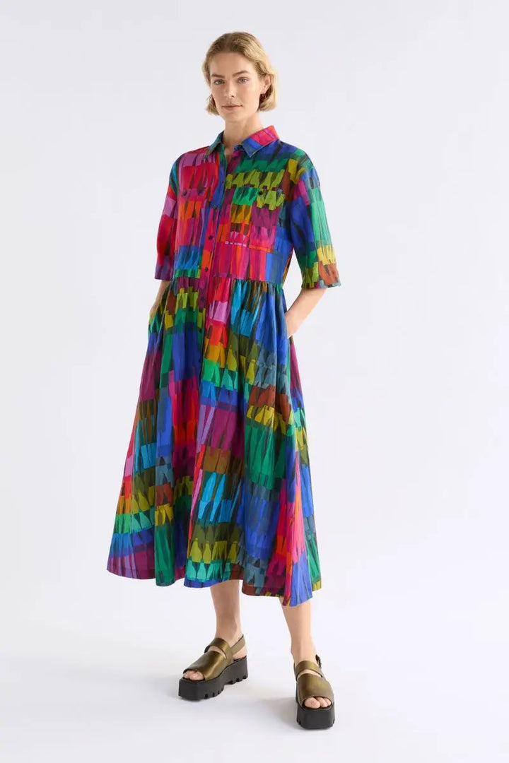 Front on view of woman in linen printed bright coloured dress with Shirt Front and collar by Elk the label