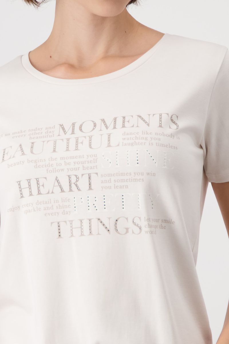 Woman wearing Monari 409081MNR Cotton Script Rhinestone T-Shirt rhinestone script detail in Cream