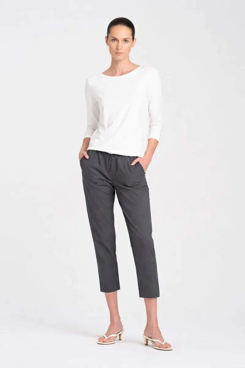 Woman wearing nomad pant F651478 in canyon front view