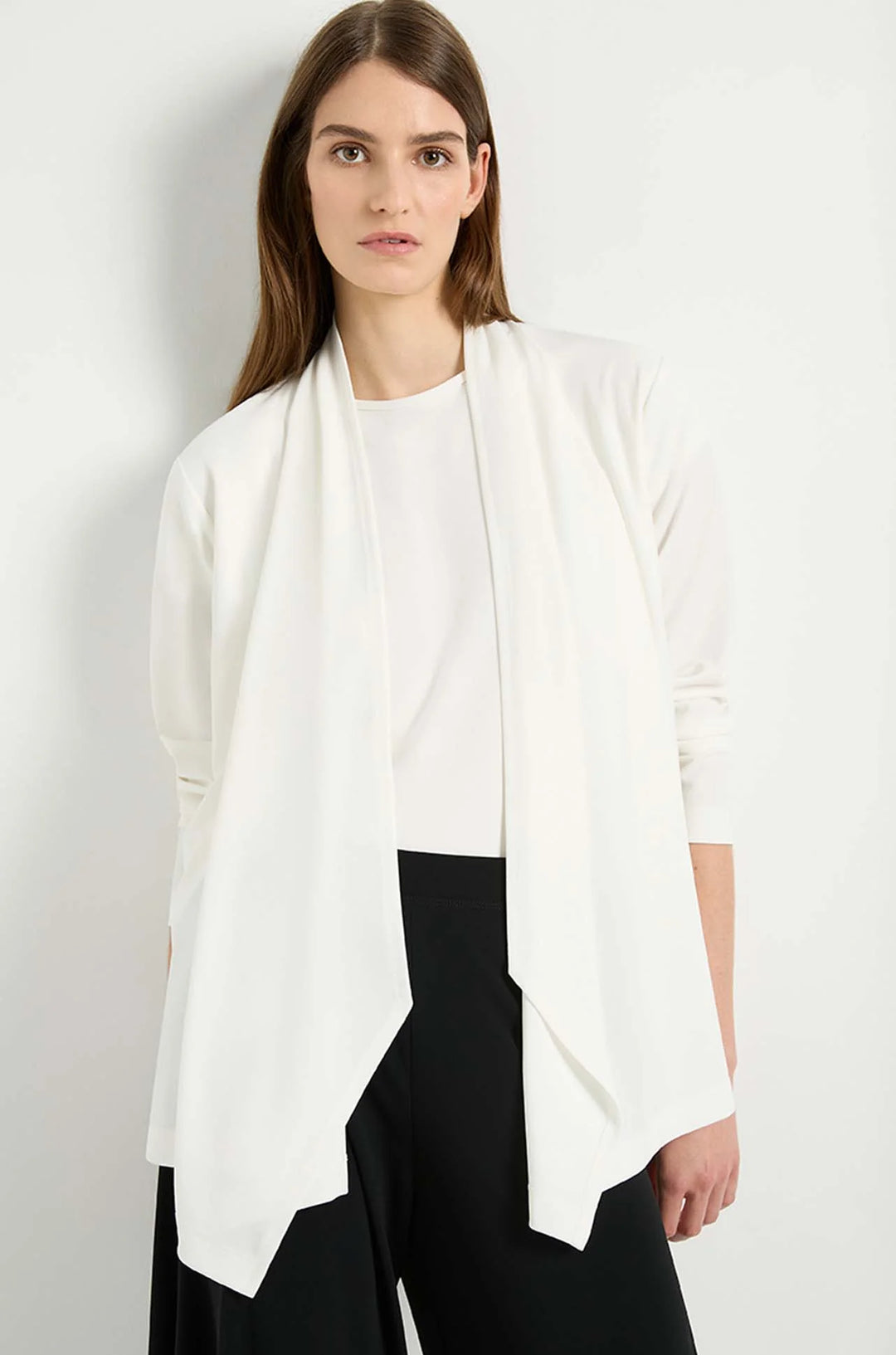 Woman wearing Mela Purdie Peak Jacket F007 4147 in Cream against white background