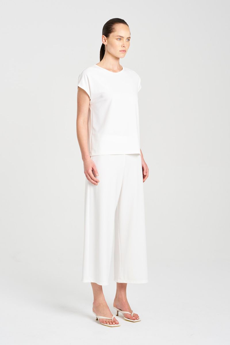 Mela Purdie capshell and Cropped plaza pant in F007 powderknit fabric in cream side view