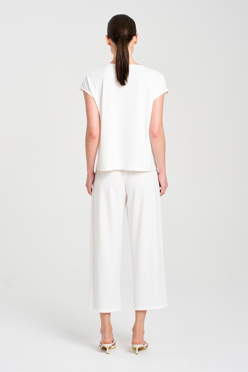 Mela Purdie capshell and Cropped plaza pant in F007 powderknit fabric in cream rear view