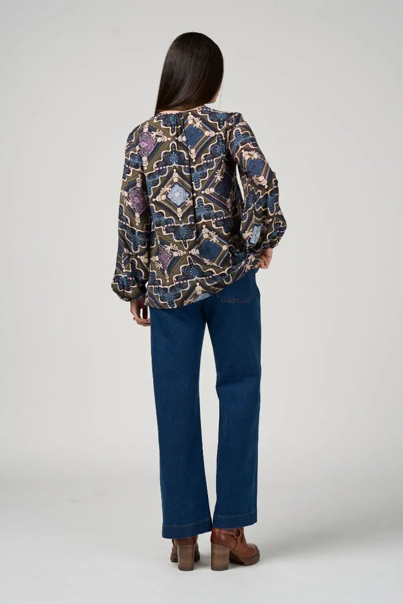 Woman wearing Loobies Story Regalia Blouse olive multi LS3200 back view