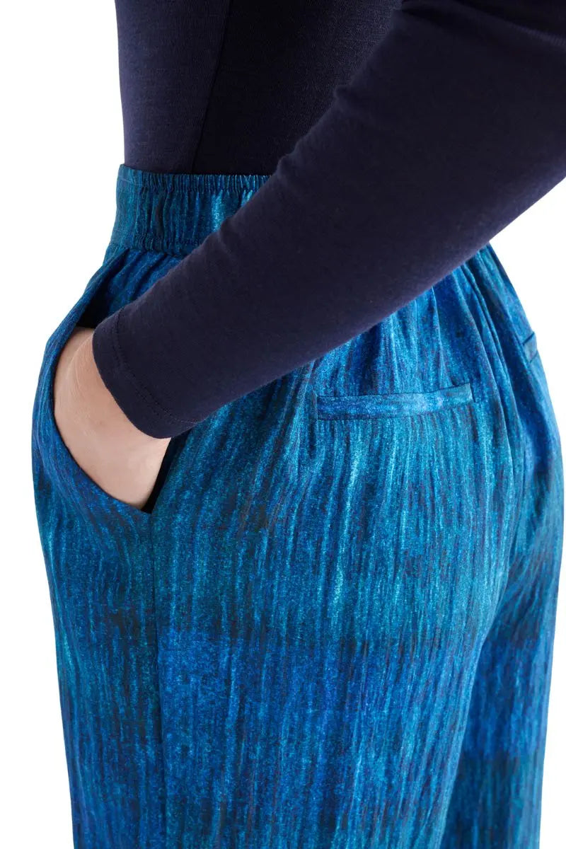 Blue pants with a dark blue top on a white background back view