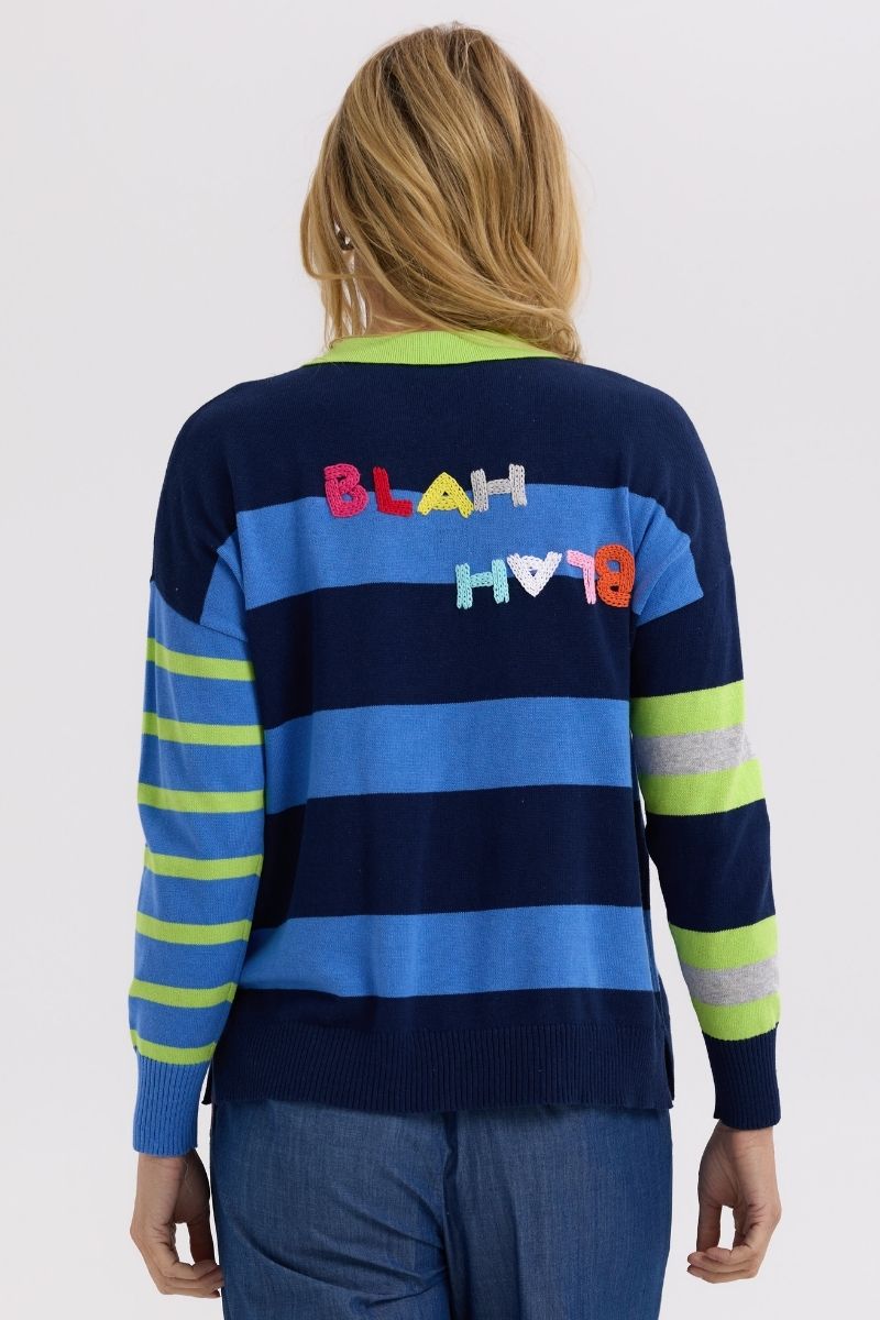 Back view of Person wearing a striped sweater with colorful text on a white background