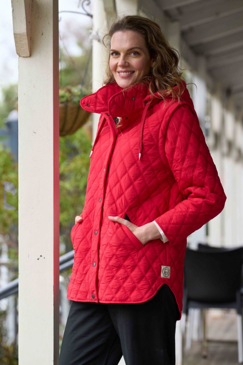 Woman wearing Wellington Jacket in Ruby Red by Charlie Jane side