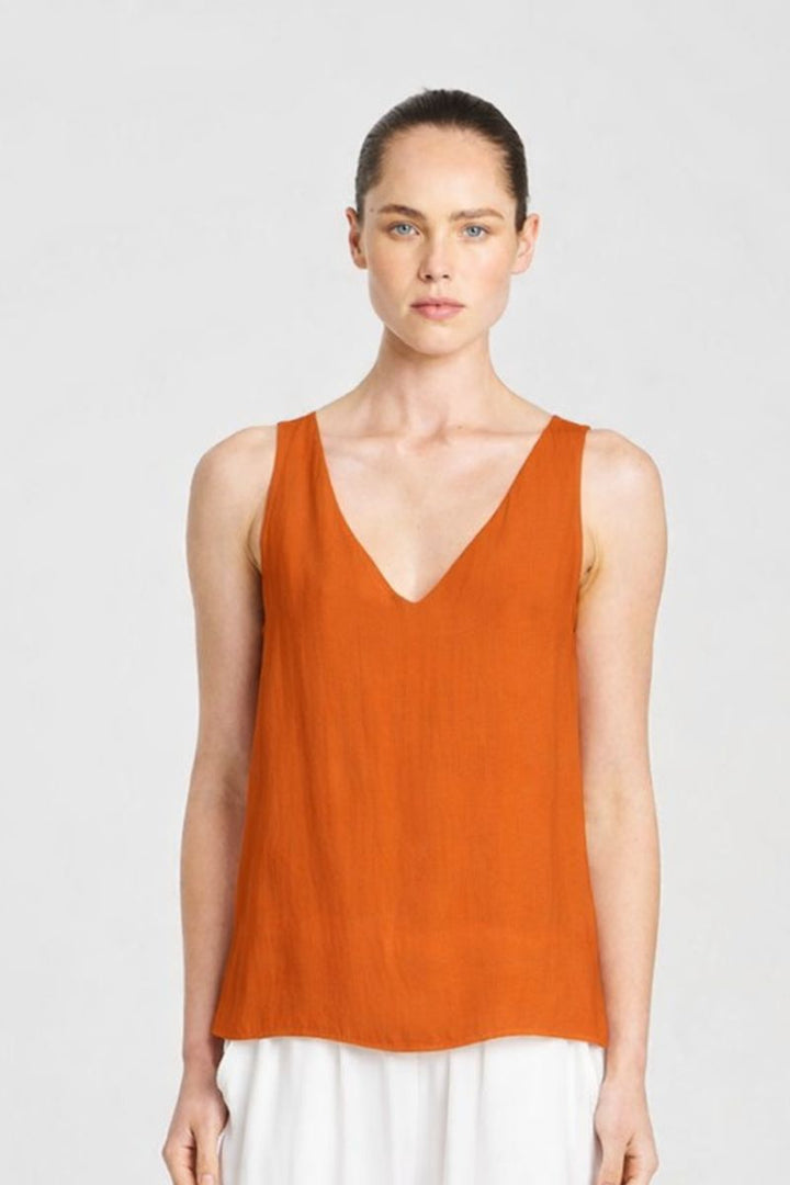 woman wearing audrey tank by Mela Purdie in copper front view