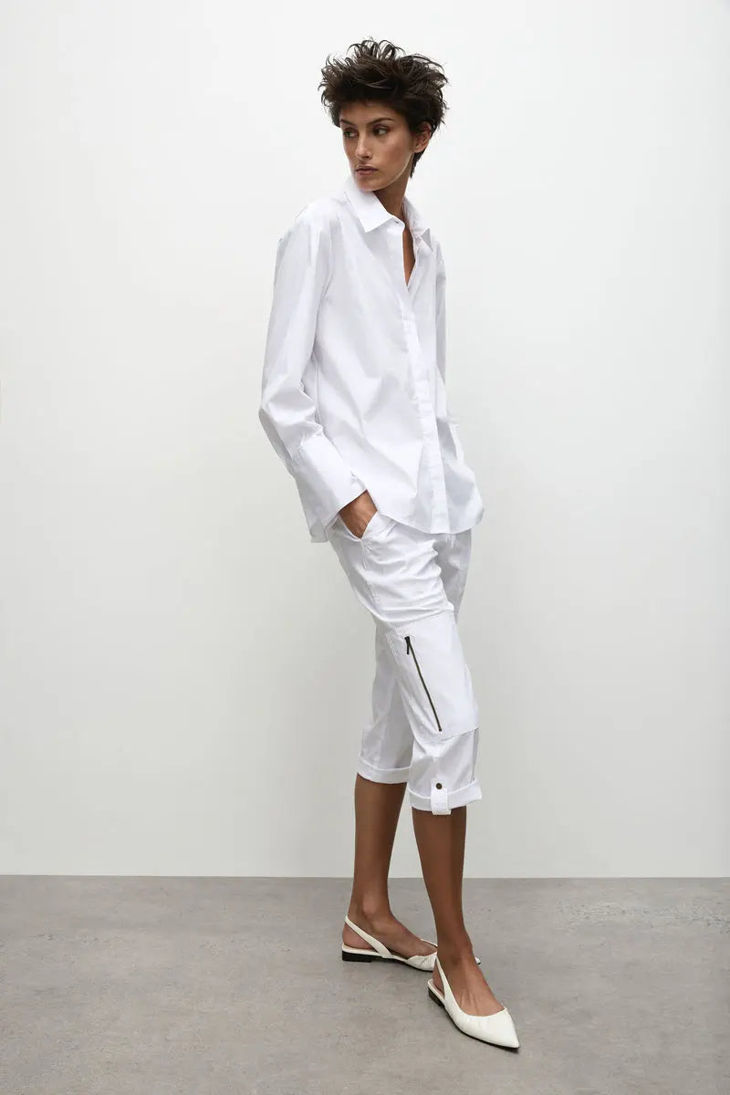 Woman wearing Cropped Zip Cargo in White by Mela Purdie F65 1386, full length three quarter view 01.