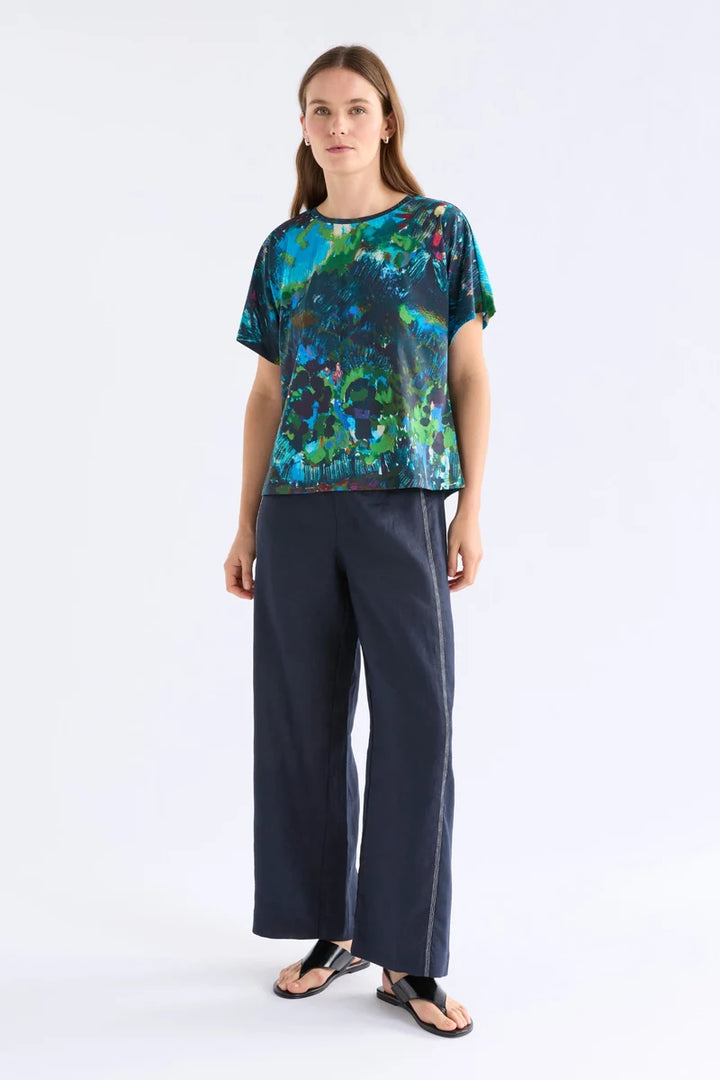 ELK Haki Short Sleeve T-Shirt A1736 in Landskap Night, full front view with navy wide-leg pants