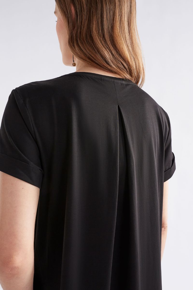 Black t-shirt worn by a person on a white background