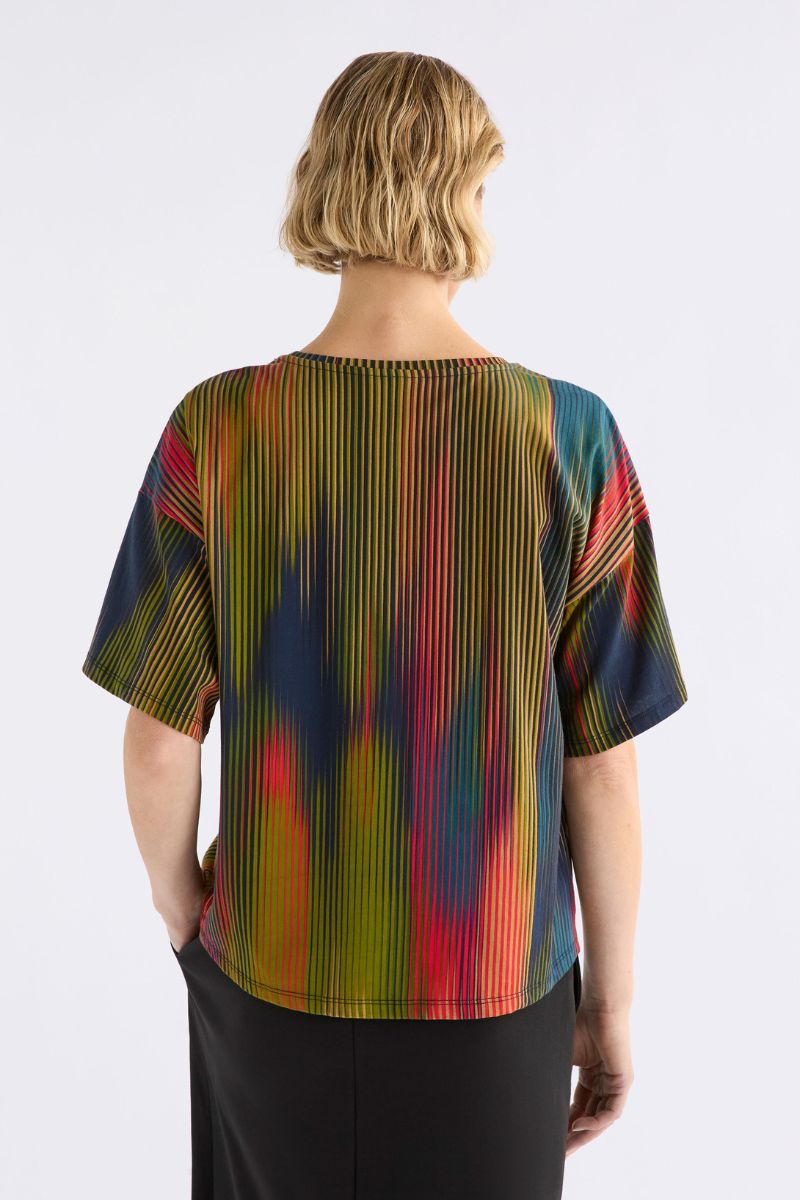 Person wearing a colorful striped shirt on a white background