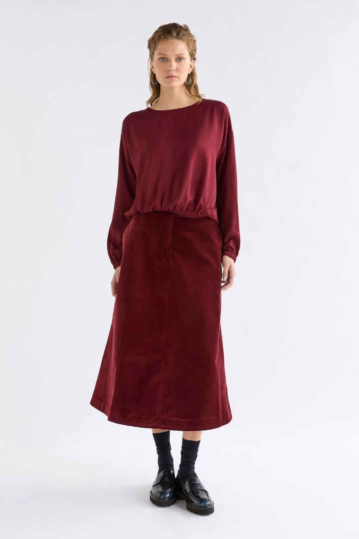 Woman wearing Altes Skirt in Merlot by ELK the Label front