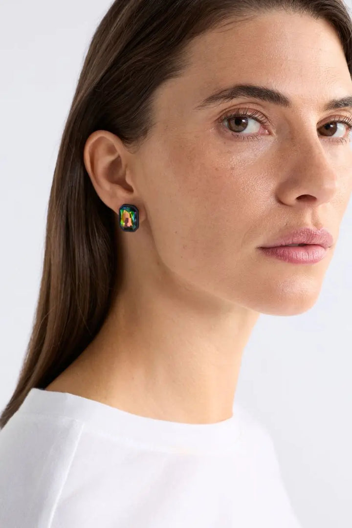 Woman wearing Jule Clip On Earrings in Iridescent Green by ELK the Label style E0612