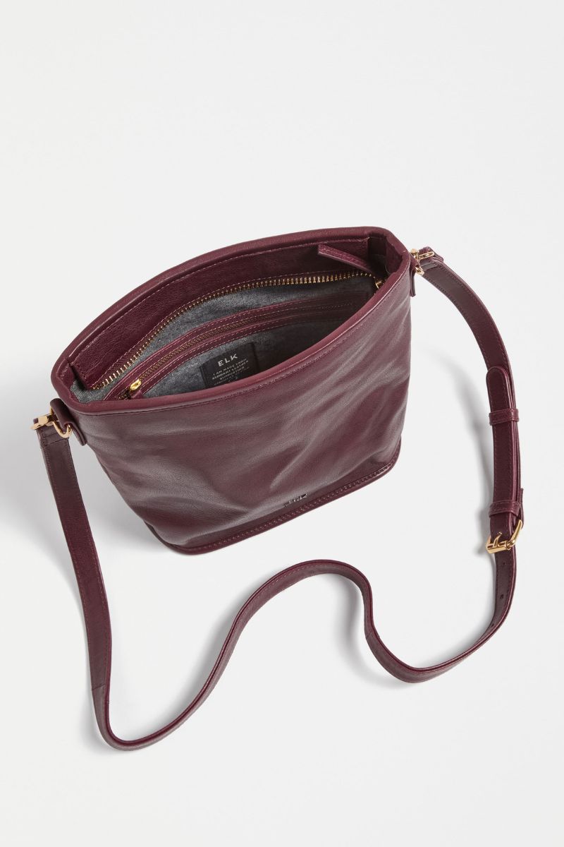 Woman wearing Kolvi Crossbody in Bordeaux by ELK the Label closeup