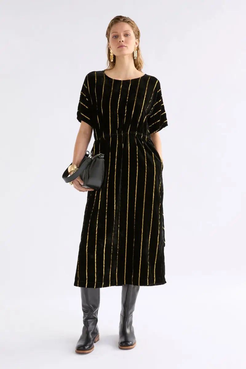 Woman wearing Lumii Dress in Black and Gold by Elk the Label front