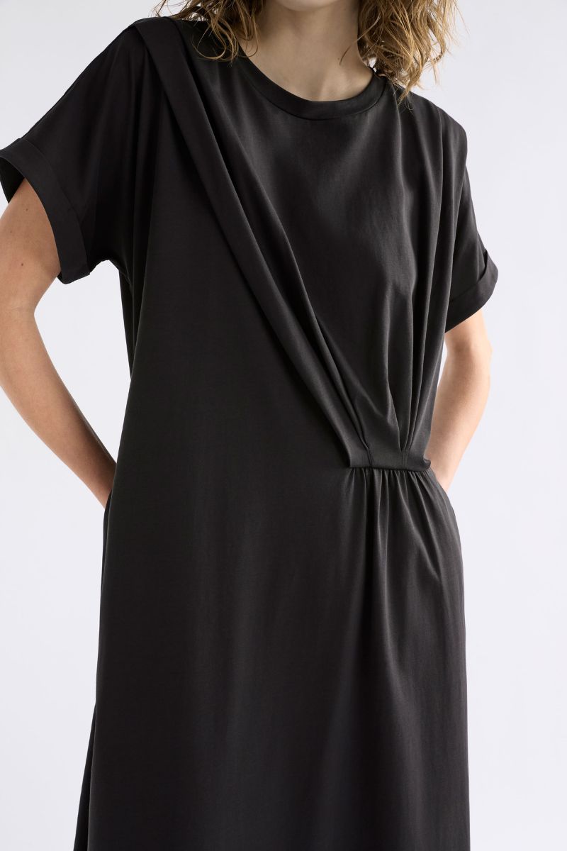 Woman wearing Elk the Label Etienne dress showing waist tuck detail