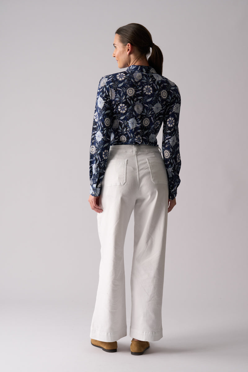 Woman wearing Risky Business Top in Bali by FOIL FO8403 back view showing floral print