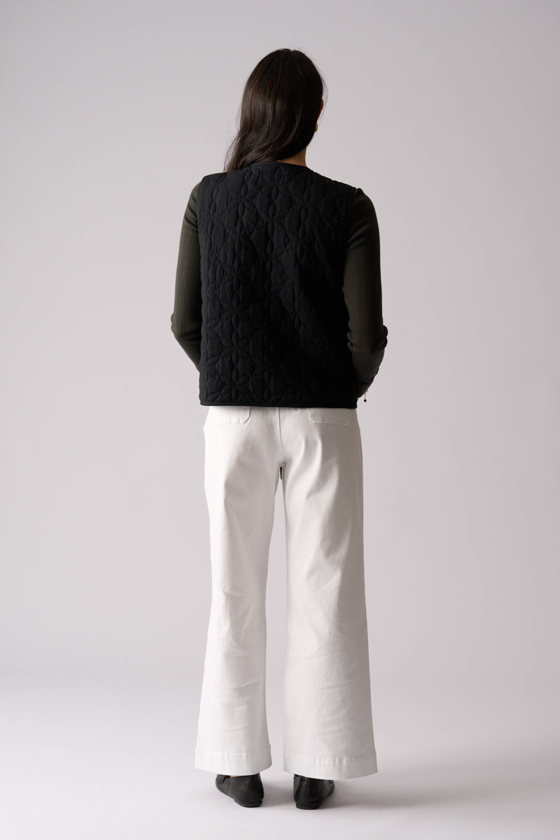 Woman wearing Bows Well Vest in Black from FOIL FO8407 back view