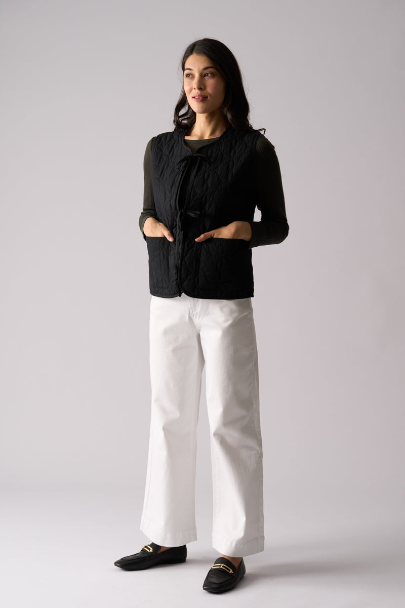 Woman wearing quilted cotton vest Bows Well Vest in Black from FOIL FO8407 outfit styling