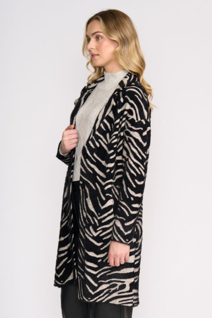 Woman wearing Lash Queen Coat in Zebra by Foil side