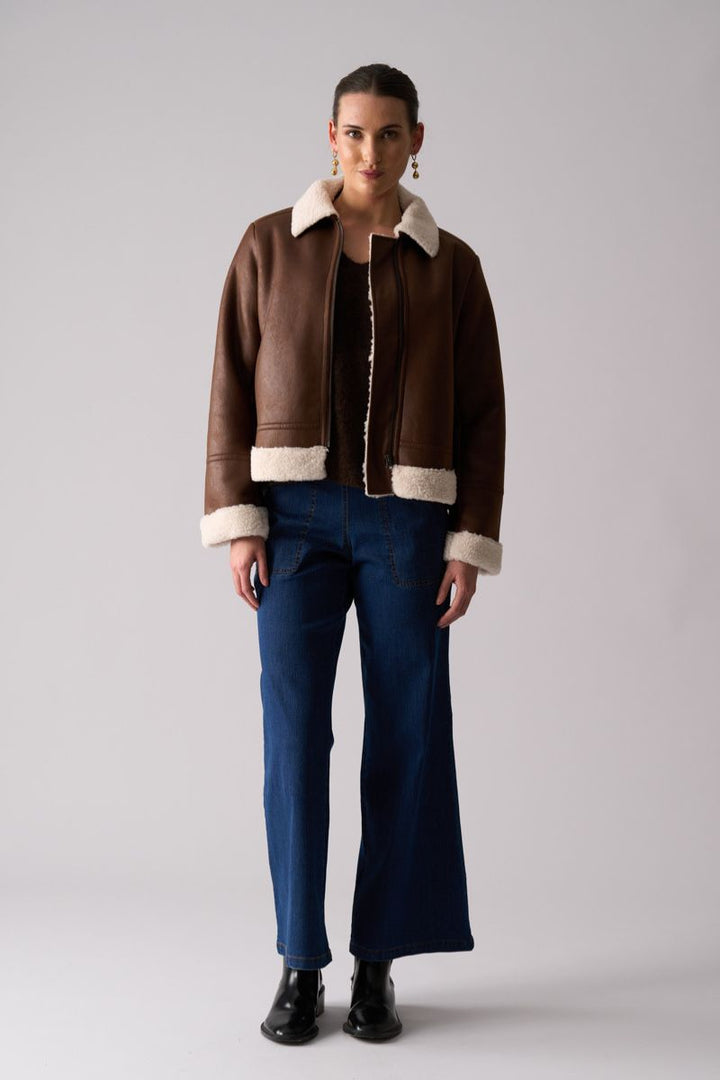 Woman wearing Flying High Jacket in Coffee by Foil front