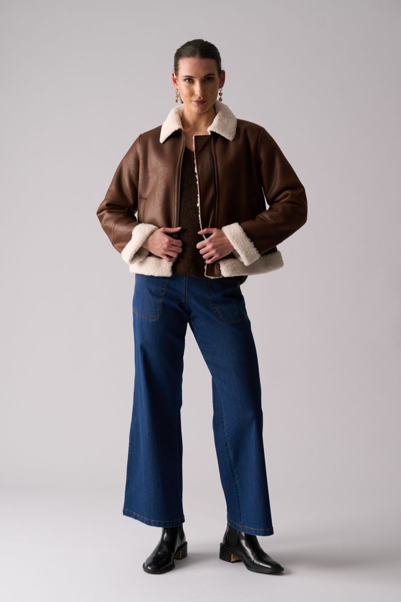 Woman wearing Flying High Jacket in Coffee by Foil styled