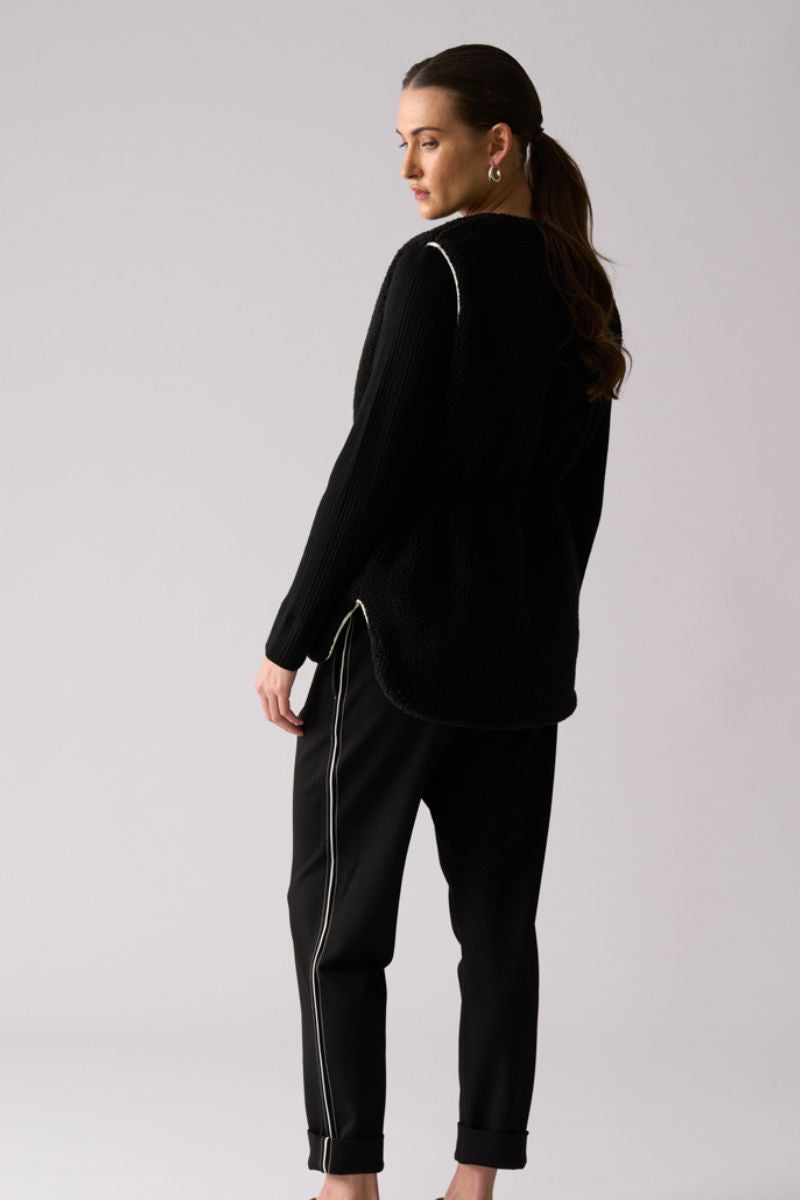 Woman wearing Top Kat Reversible Gilet in Black by Foil back