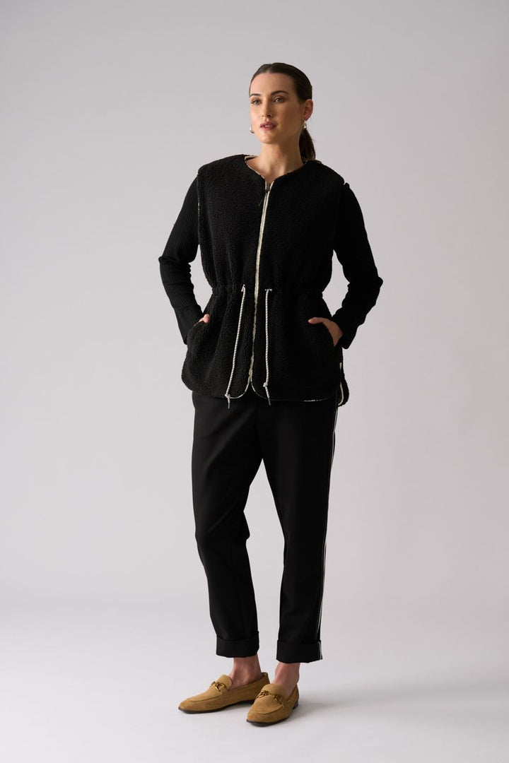 Woman wearing Top Kat Reversible Gilet in Black by Foil front