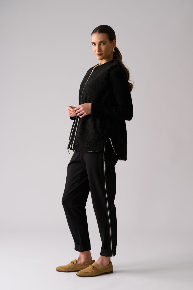 Woman wearing Top Kat Reversible Gilet in Black by Foil side