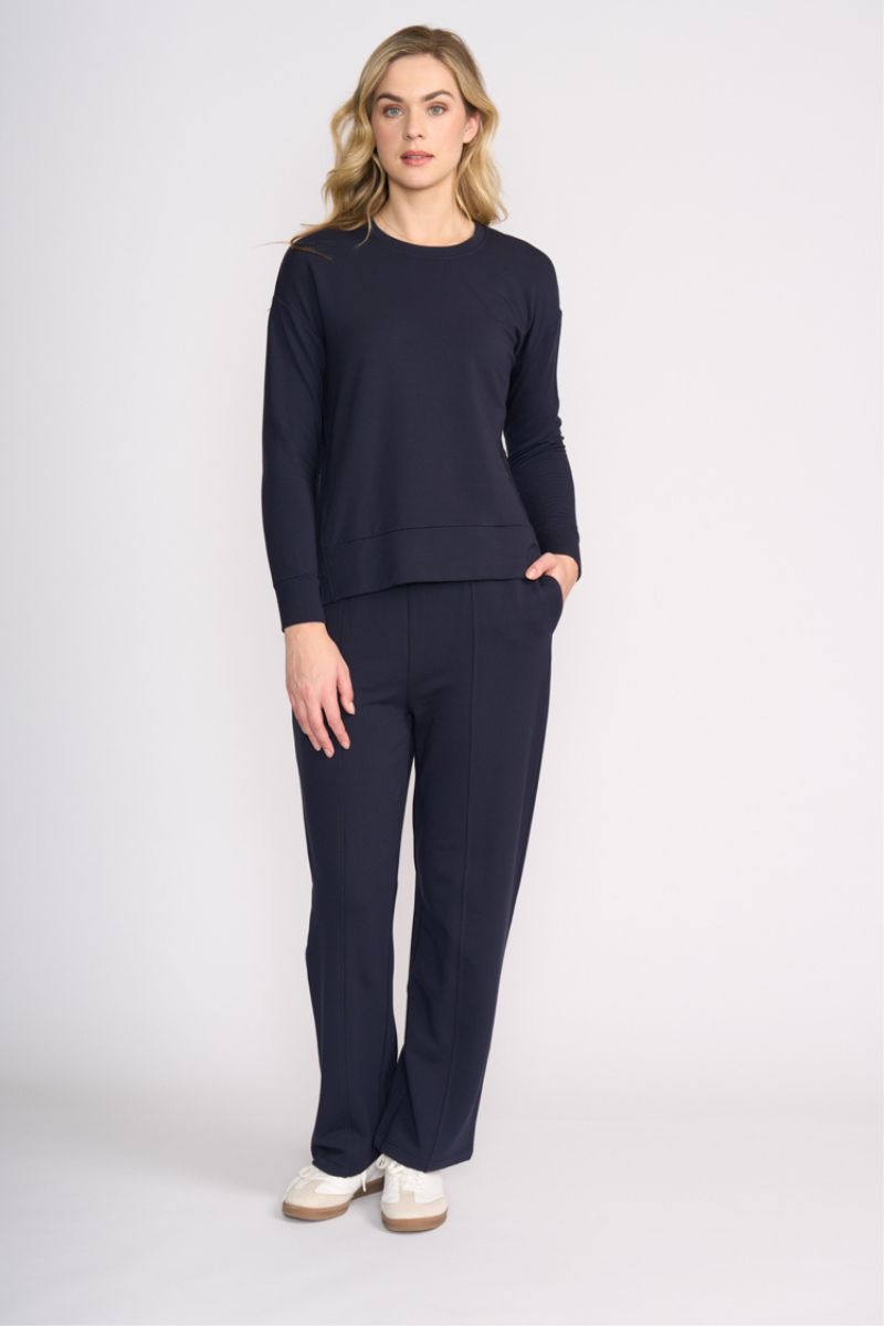 Woman wearing Smooth Talker Pant in Navy by Foil front
