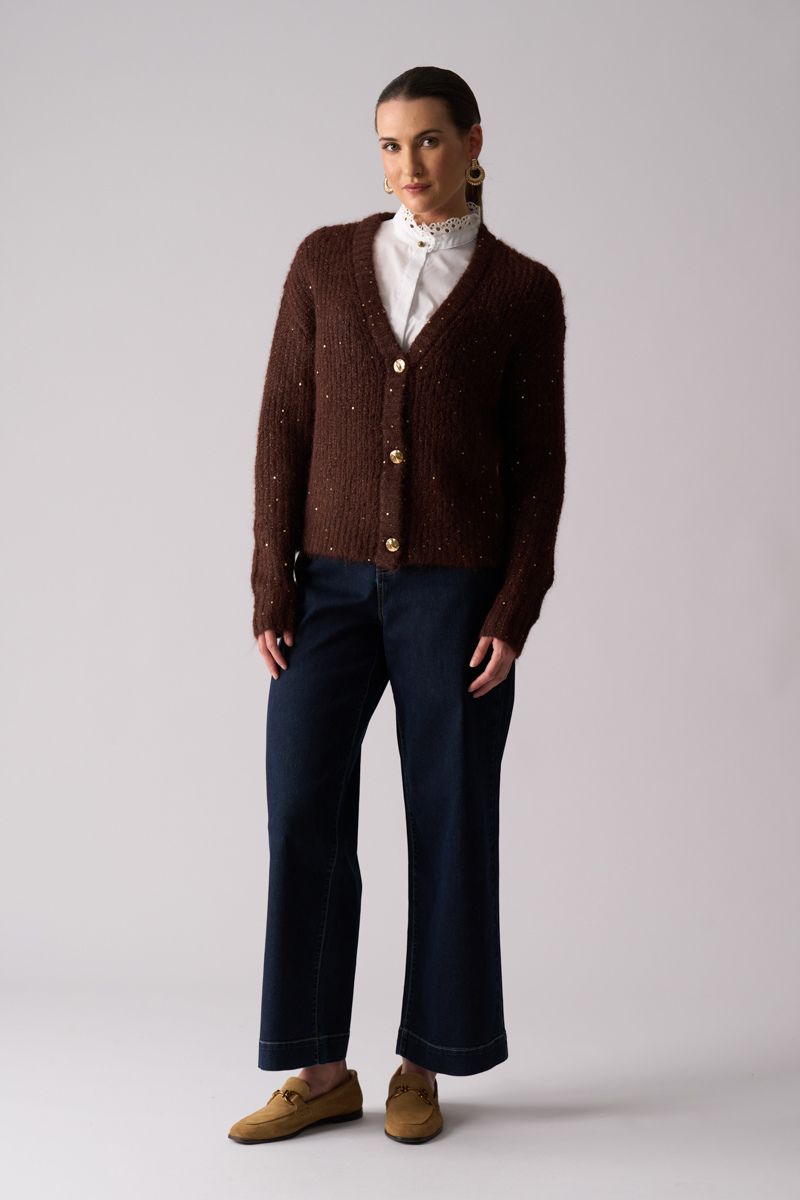 Woman wearing Glow Getter Cardigan in Coffee by Foil front