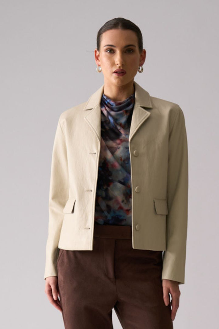 Woman wearing Faux Real Jacket in Stone by Foil front