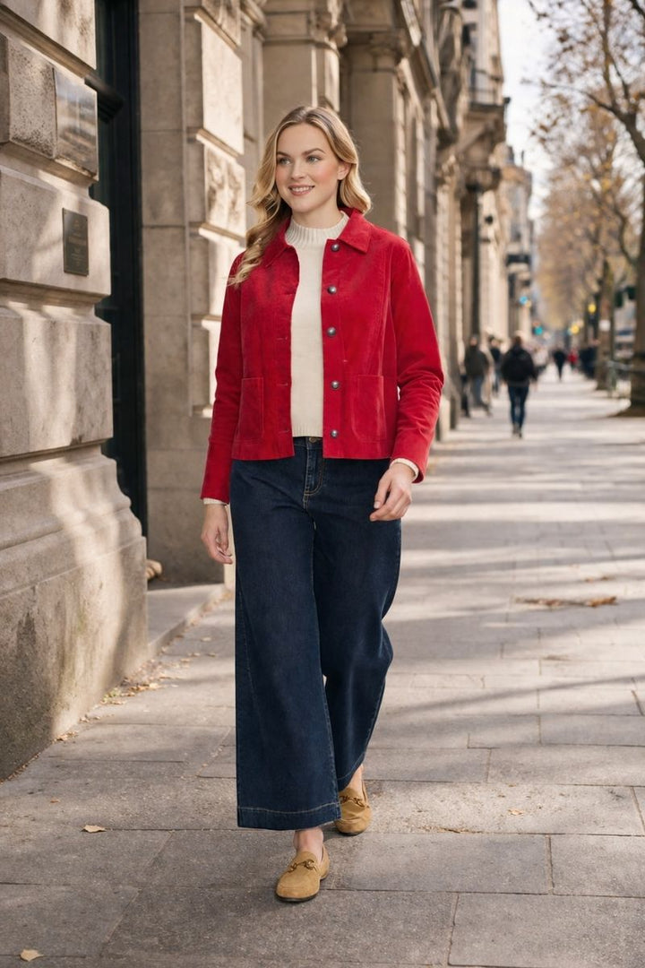 Women wearing the pre record jacket in rose with jeans and a cream jumper on a melbourn street