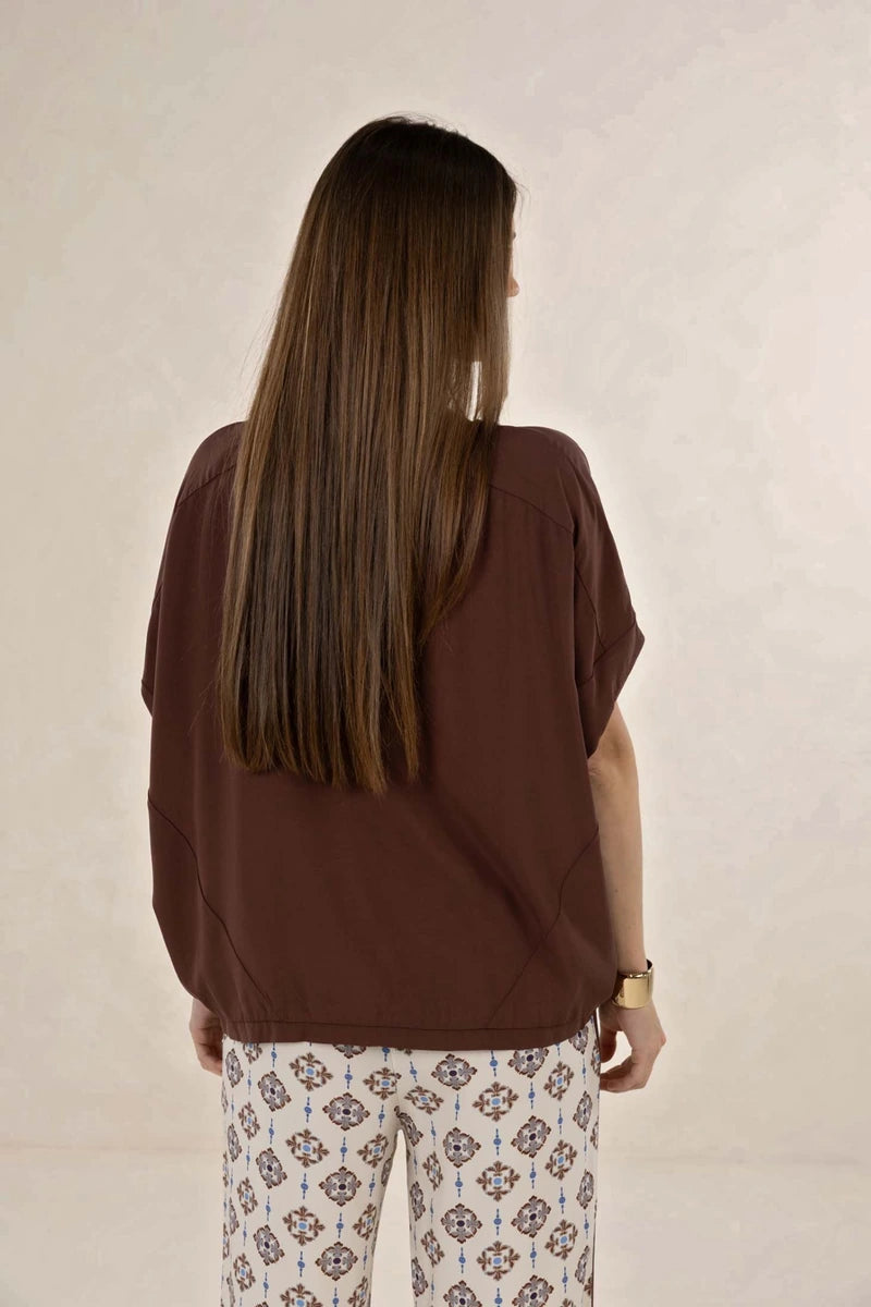 Humidity Lifestyle Lush Top HS26212 in Cacao, back view showing oversized fit, panel detailing and shaped hem.
