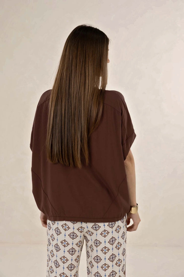 Humidity Lifestyle Lush Top HS26212 in Cacao, back view showing oversized fit, panel detailing and shaped hem.