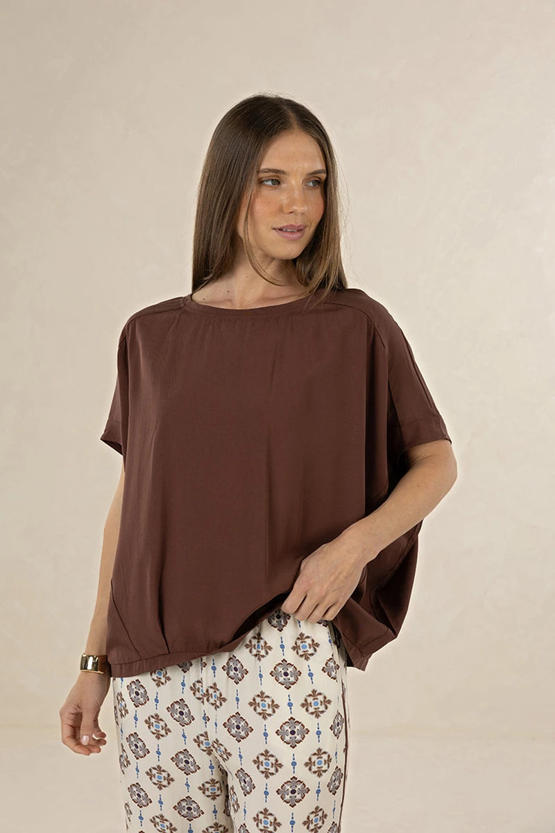 Humidity Lifestyle Lush Top HS26212 in Cacao, front lifestyle view showing oversized batwing silhouette and boat neckline.