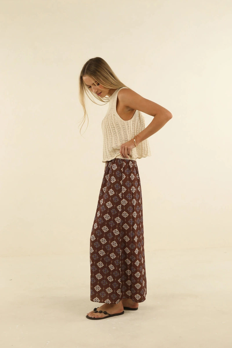 Humidity Lifestyle Vintage Tales Skirt HS26209 in Choc/Cream, side view showing the fluid maxi silhouette and patterned fabric.
