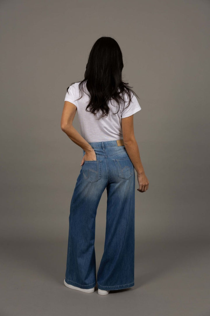 Woman wearing Ryder Jean in Blue Wash by Humidity Lifestyle HW26400 back view