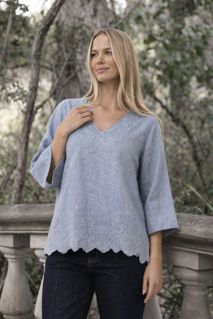 Woman wearing Serre Top in Misty Grey by Humidity Lifestyle HW26503 front view Modelled in garden setting