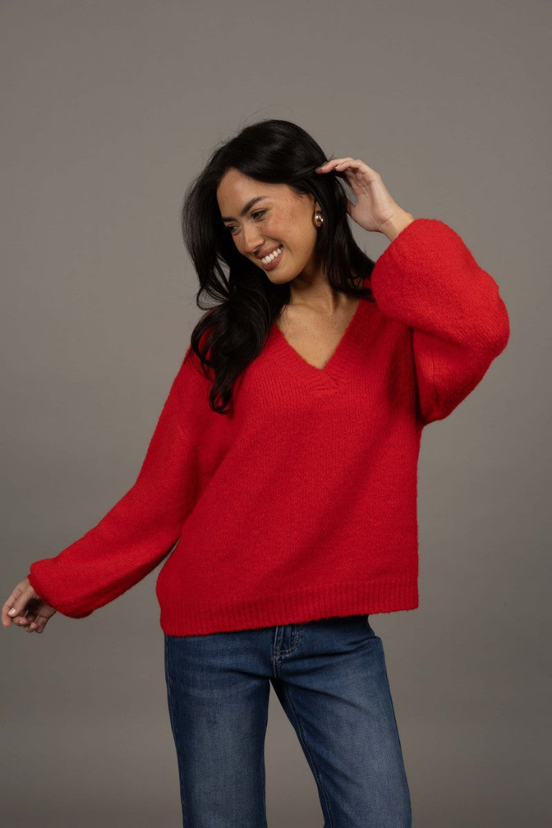 Woman wearing Nouveau V Neck Jumper in Scarlet by Humidity Lifestyle HW26217 styled with denim