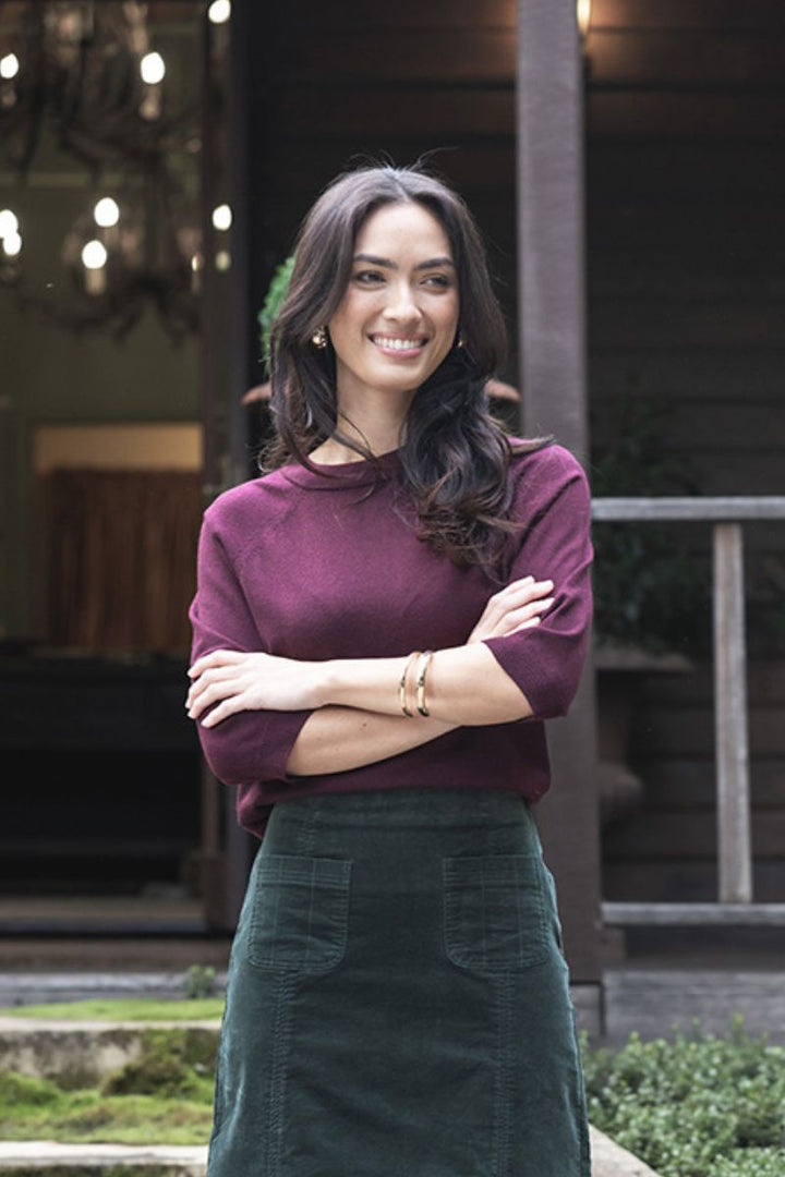 Woman wearing Grace Top in Merlot by Humidity styled