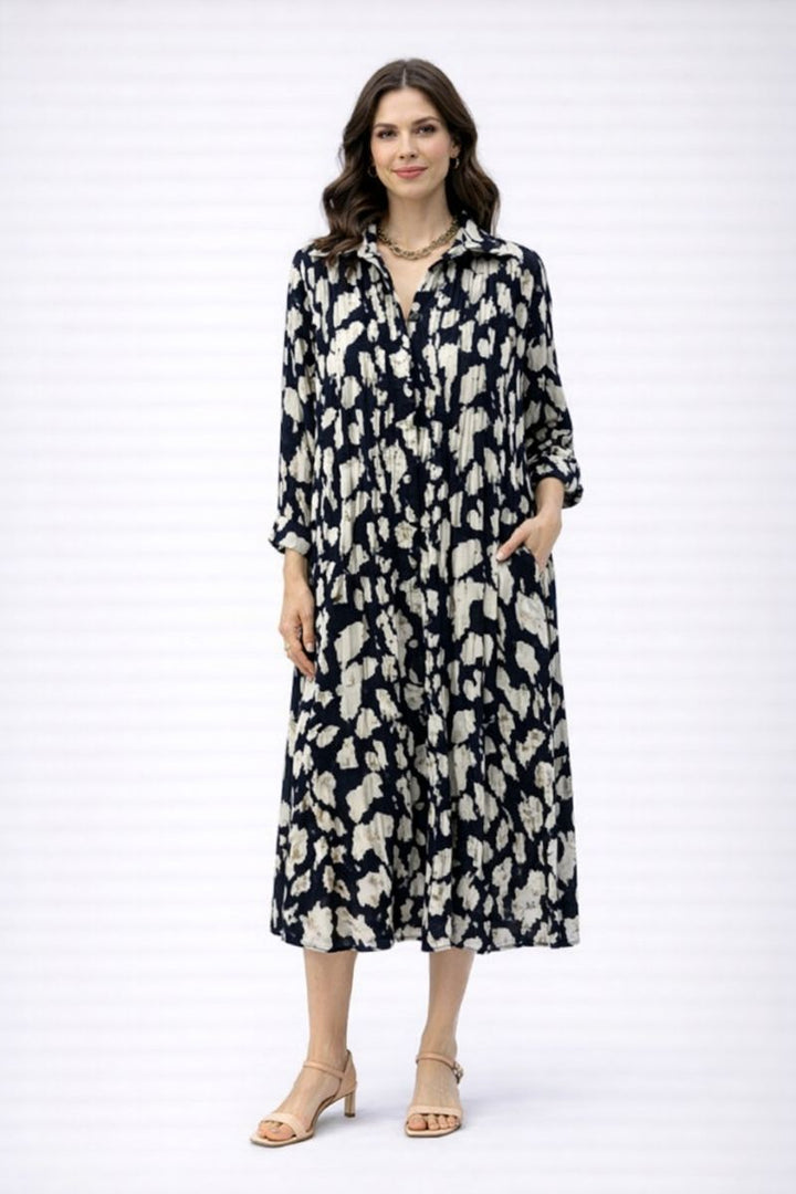Woman wearing navy and cream floral button through dress by Dress Addict JOT-500-517 front view