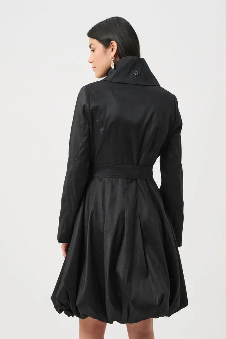 Woman wearing Joseph Ribkoff black stretch taffeta balloon coat back view