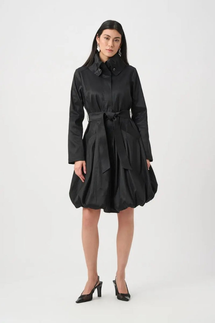 Woman wearing Joseph Ribkoff black stretch taffeta balloon coat belted front view