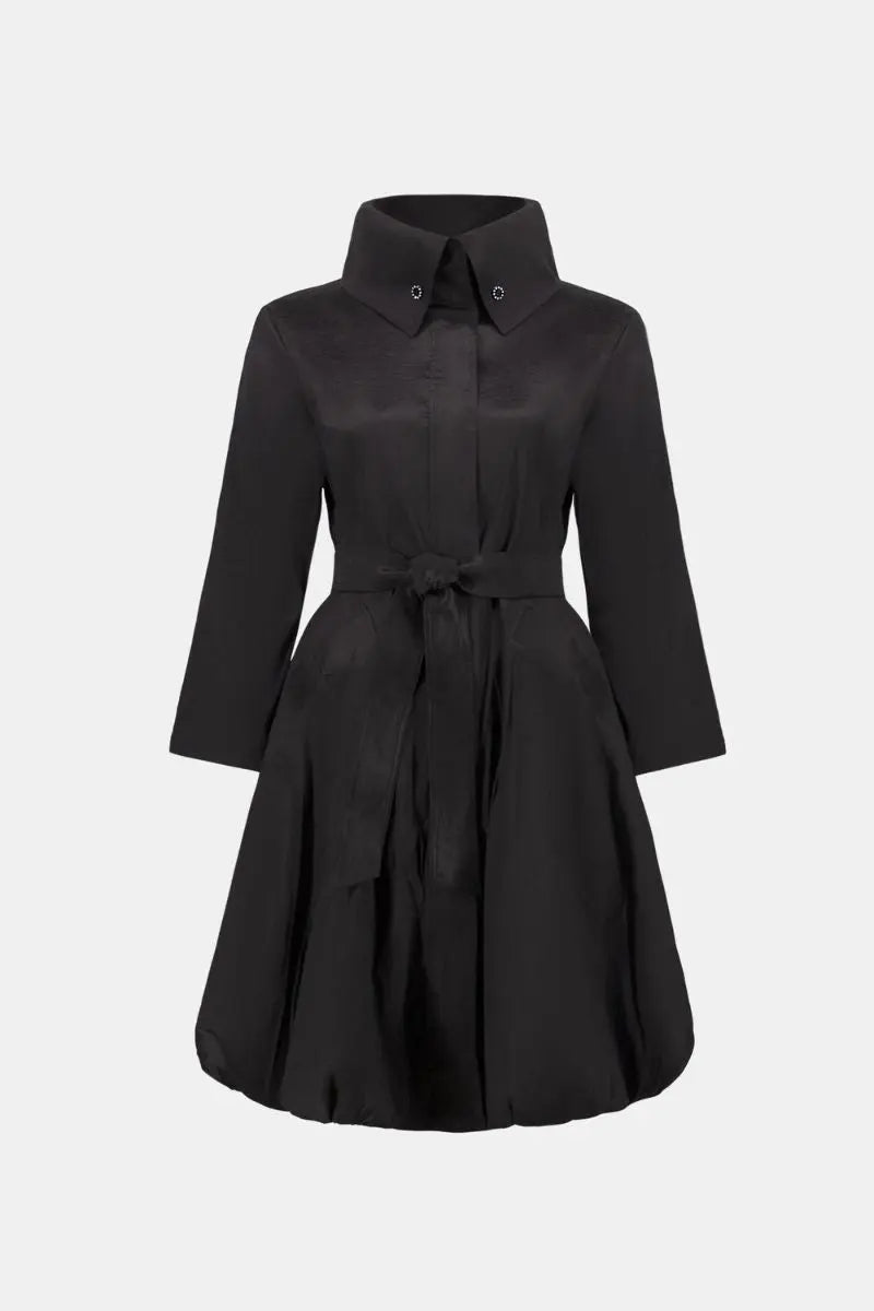 Woman wearing Joseph Ribkoff black stretch taffeta balloon coat front ghost view