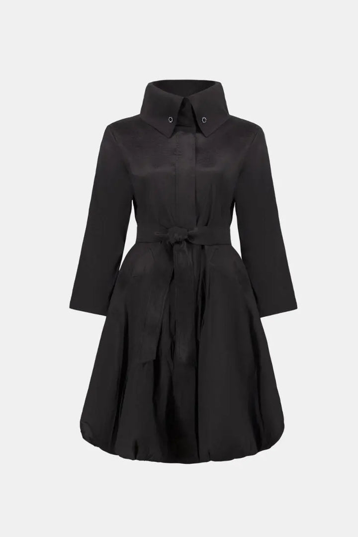 Woman wearing Joseph Ribkoff black stretch taffeta balloon coat front ghost view