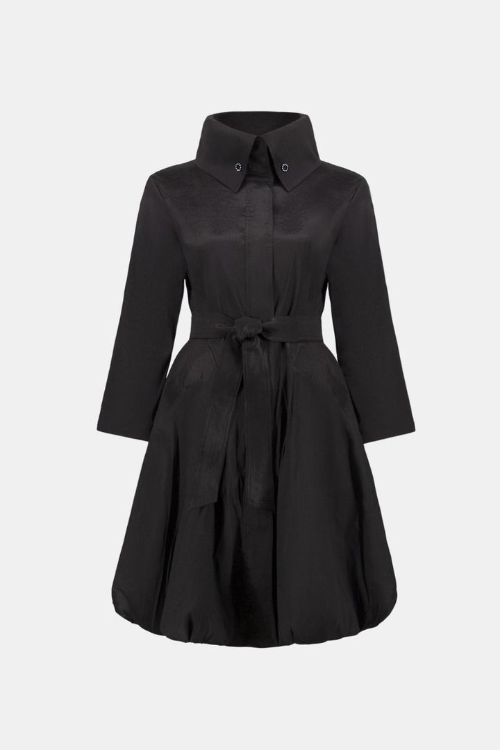 Woman wearing Joseph Ribkoff black stretch taffeta balloon coat front ghost view