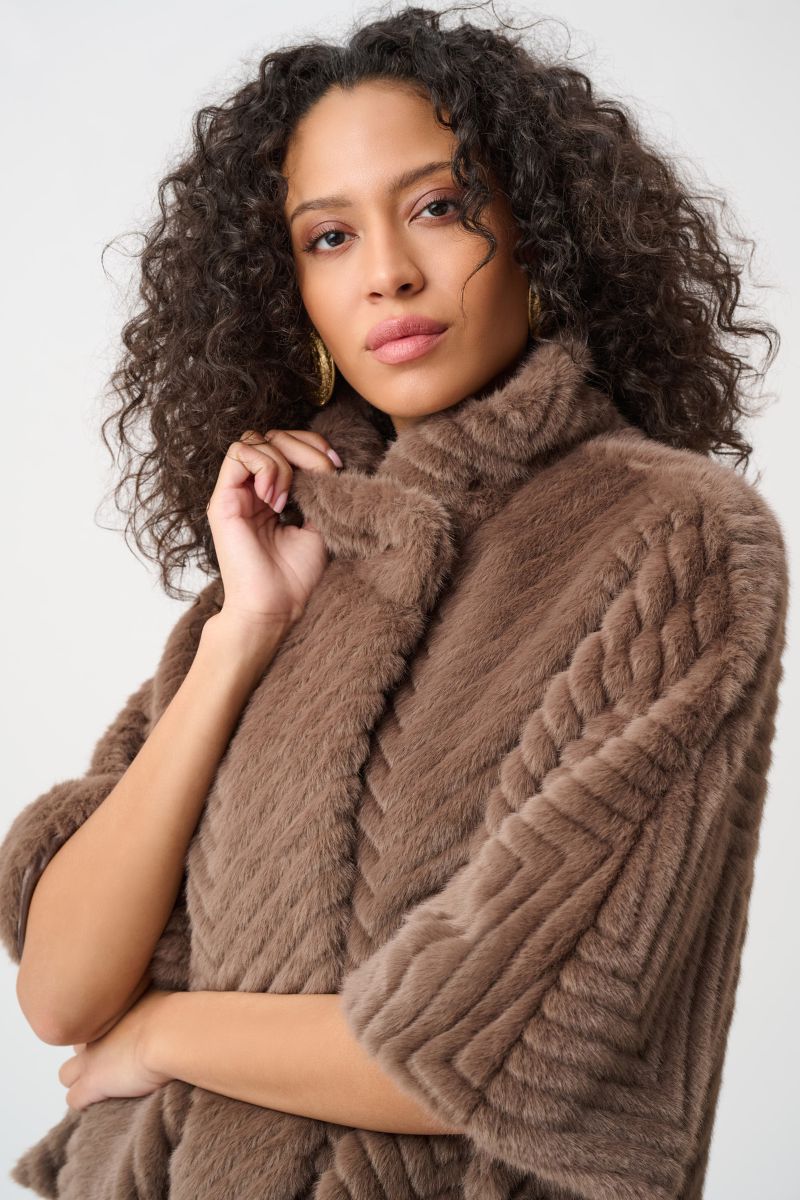 Woman wearing Joseph Ribkoff mink faux fur cape jacket collar detail